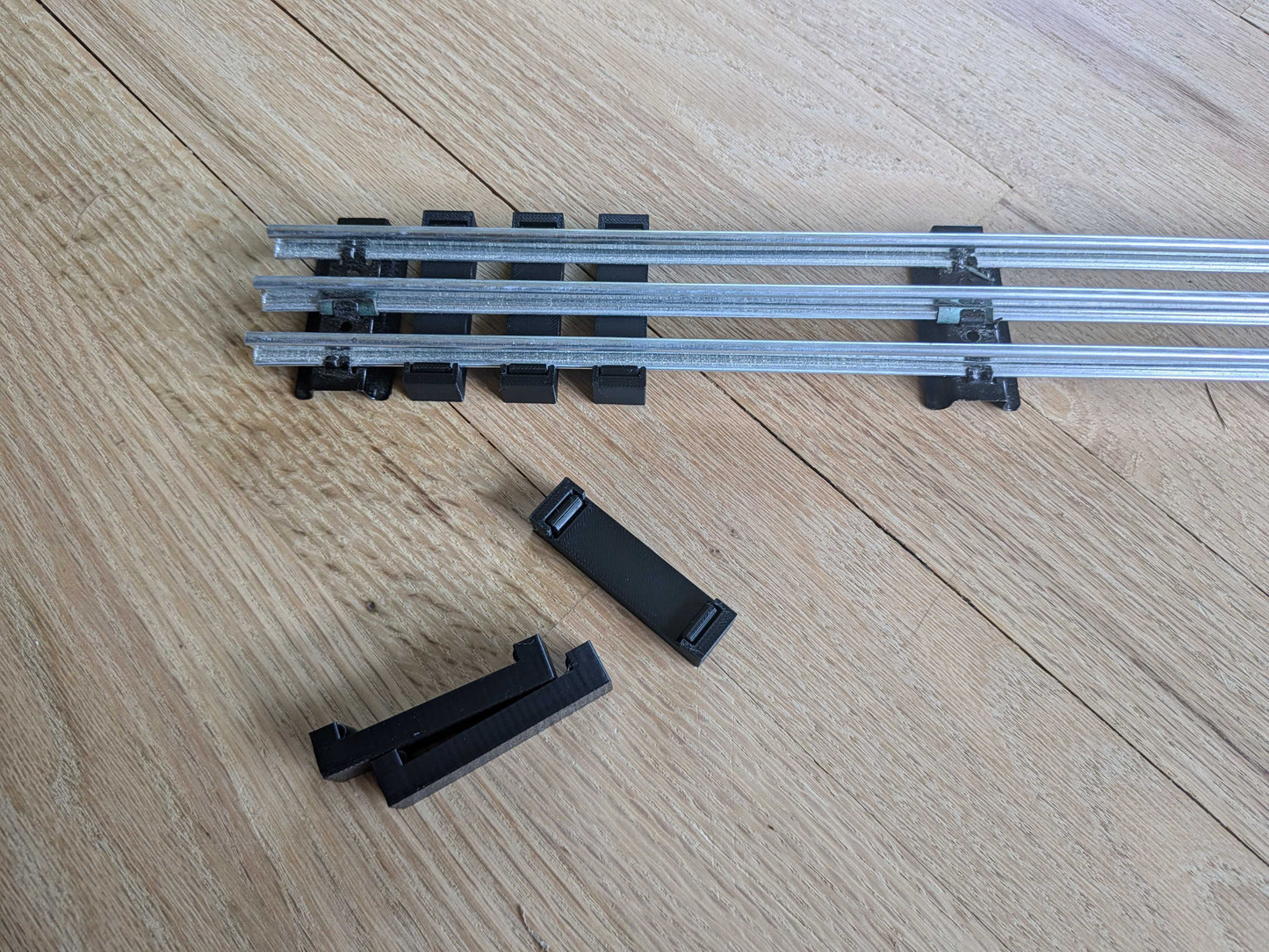 Snap on Railroad Ties for O Gauge Model Railroads Using Tubular Train Track